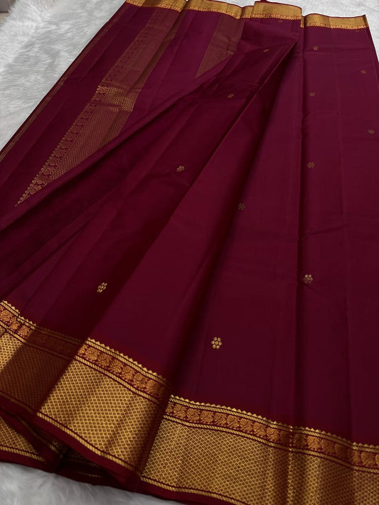 Pallu of the Kanchi Pattu lightweight saree in bottle green with Varisaipet gold zari banding