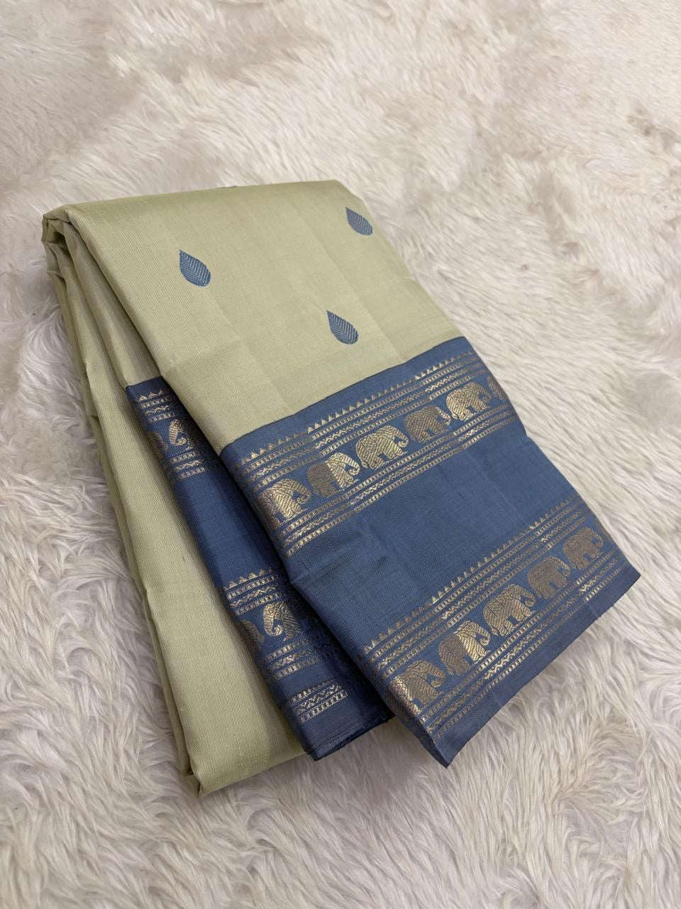 Steel blue Rettapet border of the Kancheepuram saree with Yaanai elephant procession in gold zari and geometric zari bands