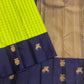 Gandaberunda and Kudhirai flying horse gold zari buttas on navy border of lime green Kanjeevaram saree — border detail