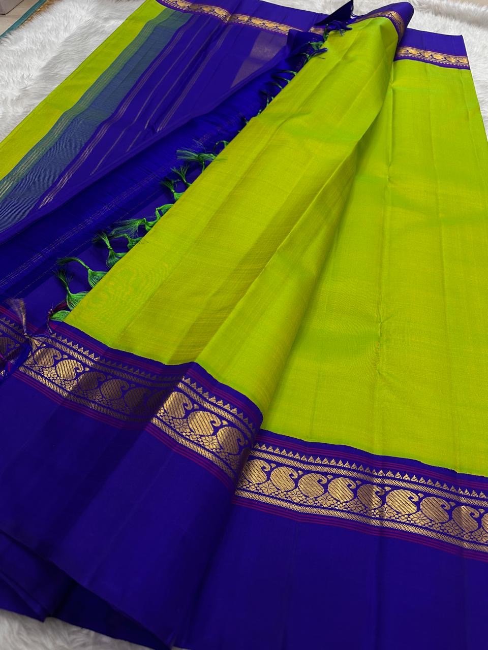 Close-up of vivid lime green pure silk body on handwoven Kancheepuram saree — high-lustre plain weave with electric fresh colour