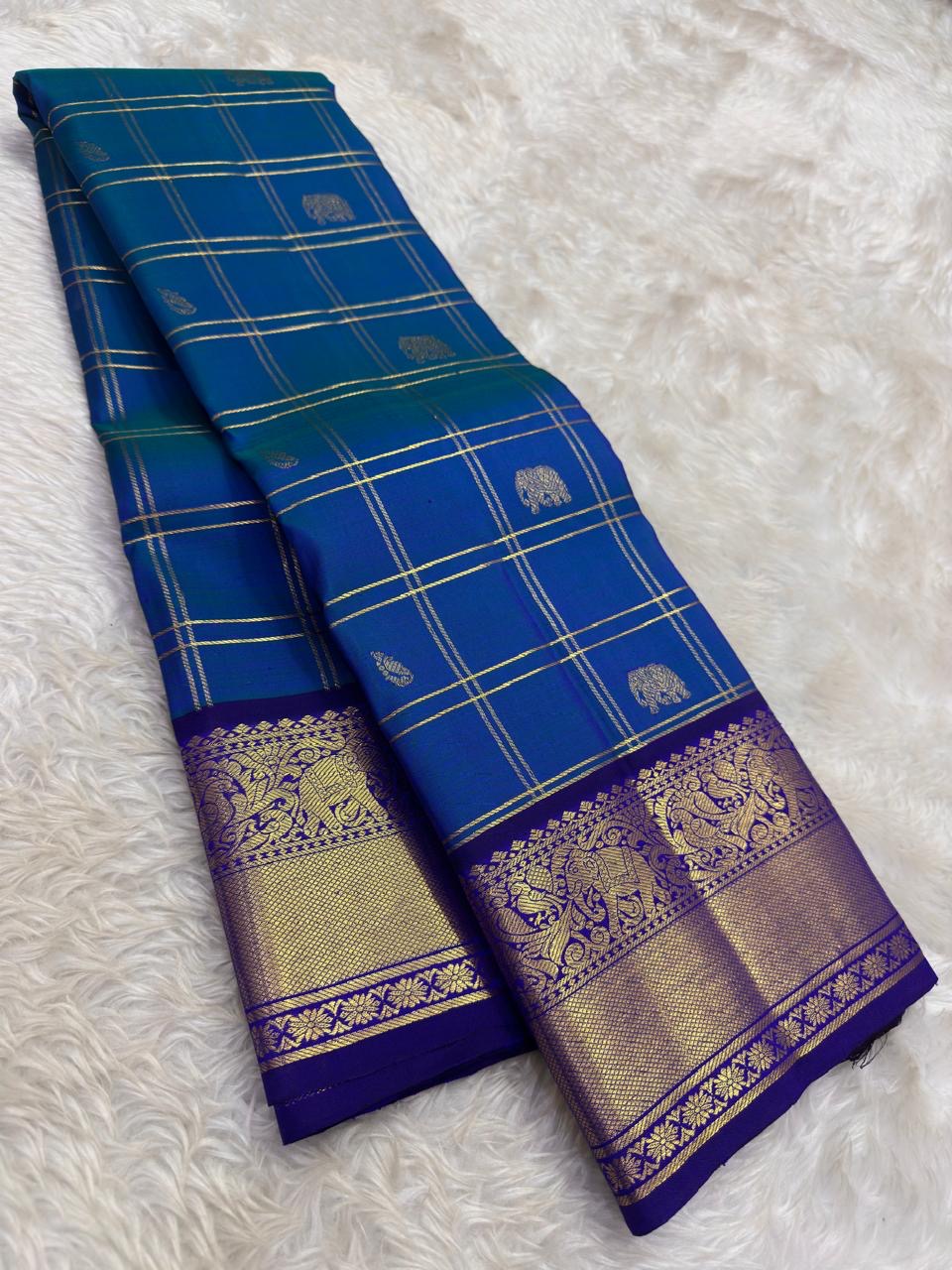 Peacock blue and violet handwoven pure silk Kancheepuram saree full view — shot colour Zari Kattam body with Yaanai Maanga buttas and deep violet antique gold zari border, Idam Living