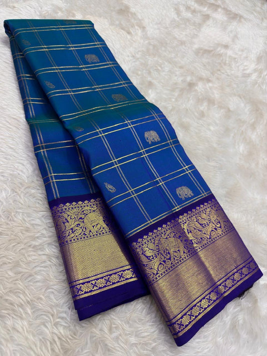 Peacock blue and violet handwoven pure silk Kancheepuram saree full view — shot colour Zari Kattam body with Yaanai Maanga buttas and deep violet antique gold zari border, Idam Living