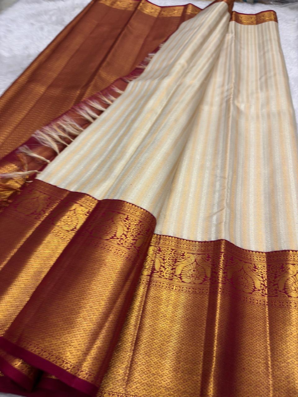 Close-up of ivory silk body with ornate all-over gold zari weave — Kanchi Pattu Butta saree body detail