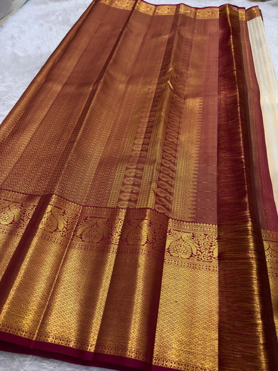 Deep crimson border with Mayil Butta peacock figurals in antique gold zari — Kanchi Pattu Butta saree