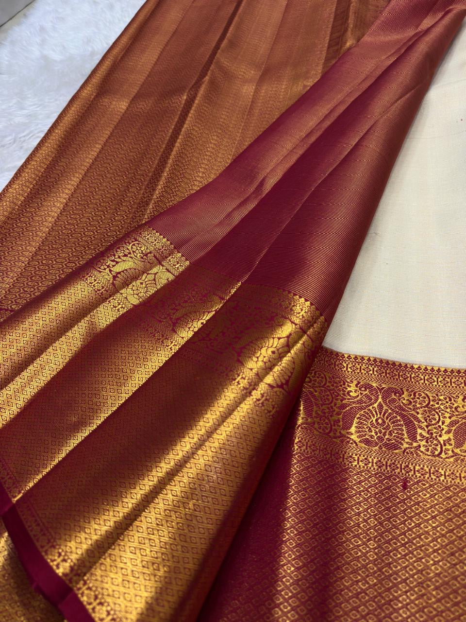 Grand Mayil Butta peacock pallu in antique gold zari on deep crimson ground — Kanchi Pattu silk saree