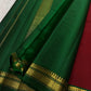Detail of the Pillayar Reku at the body-border junction — Ganesha motif woven continuously in gold zari on bottle green ground