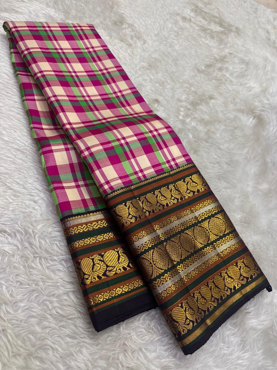 Handwoven Kanchi Pattu Paalum Pazhamum saree in multicolour silk checks with forest green Yaanai Butta gold zari border, full folded view