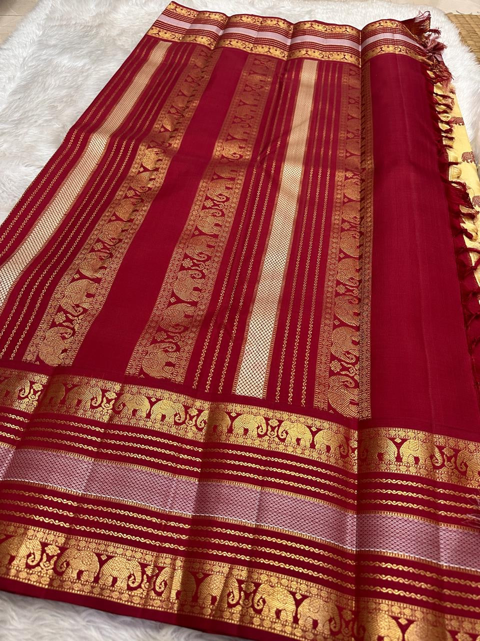 Close view of the ivory silk body showing large peony blooms in dusty rose and gold with smaller flowers in deep pink and botanical vines