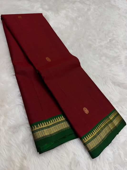 Handwoven pure silk Kanjeevaram lightweight saree in arakku red and bottle green, Korvai construction with Floral Butta body and Pillayar Reku border — Idam Living