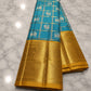 Handwoven pure silk Kanchi Pattu saree in turquoise blue with Zari Kattam body, Vanasringaram Butta in 3 gram gold zari, and wide Vanasringaram border — Idam Living