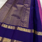 Folded view of magenta and violet handwoven pure silk Kanchi Pattu saree with Zari Kattam body and Rettapet Paisley Peacock border