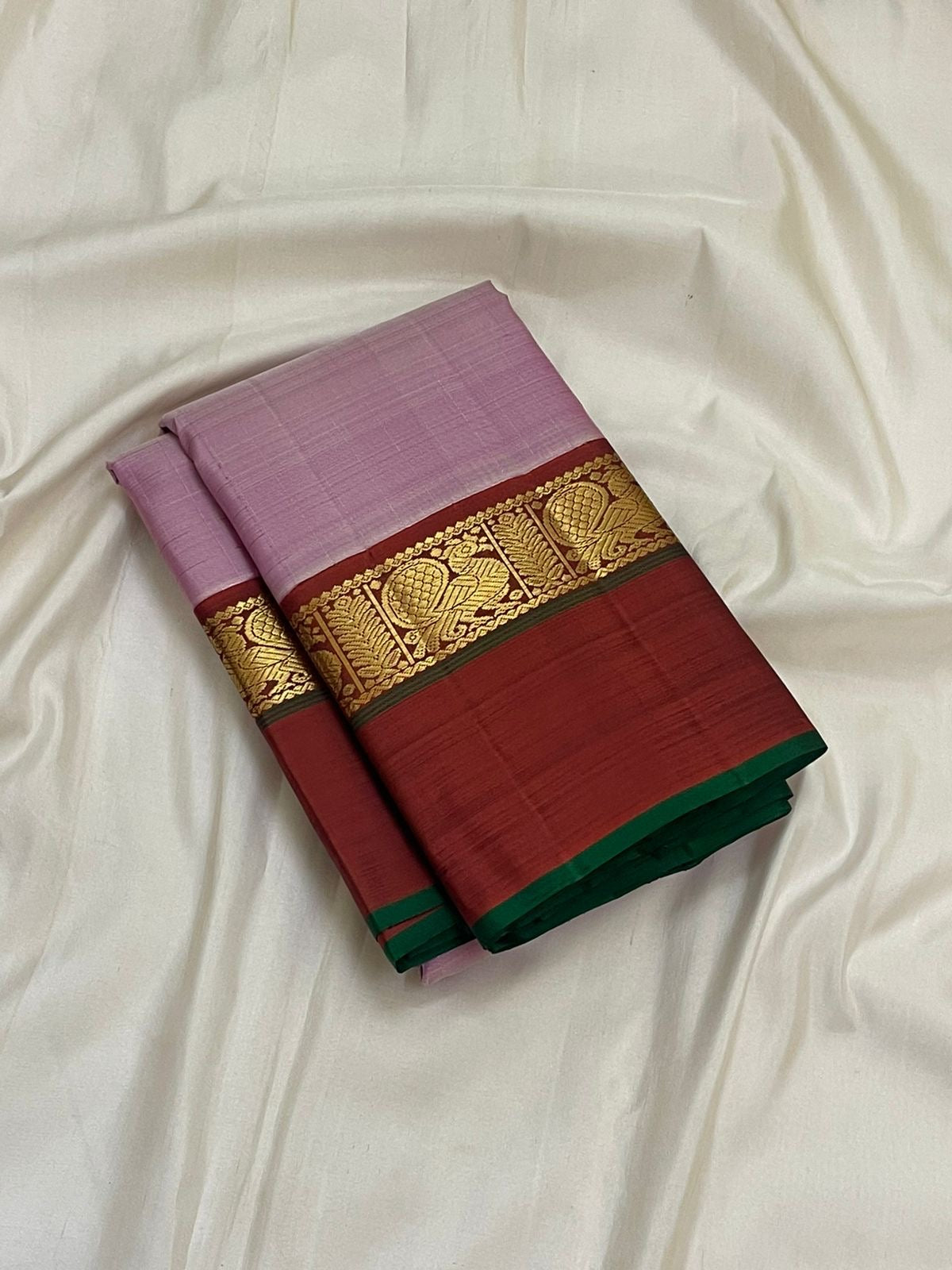 Mauve pink and deep maroon handwoven pure silk Kanjivaram Korvai Kaal Irangiya saree — full folded overview