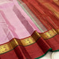 Mauve pink and deep maroon Kanjivaram Korvai saree folded — Kaal Irangiya border visible