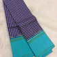 Folded view of navy blue and white handwoven pure silk Kanchi Pattu saree with Kanchi Kattam check body and sky blue border