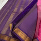 Folded view of the handwoven radiant pink KanchiPattu lightweight silk saree showing Vairaoosi body and purple Varisaipet border