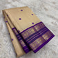 Close view of the ivory gold silk body showing Kamalam Butta in wisteria purple silk thread scattered across the full length