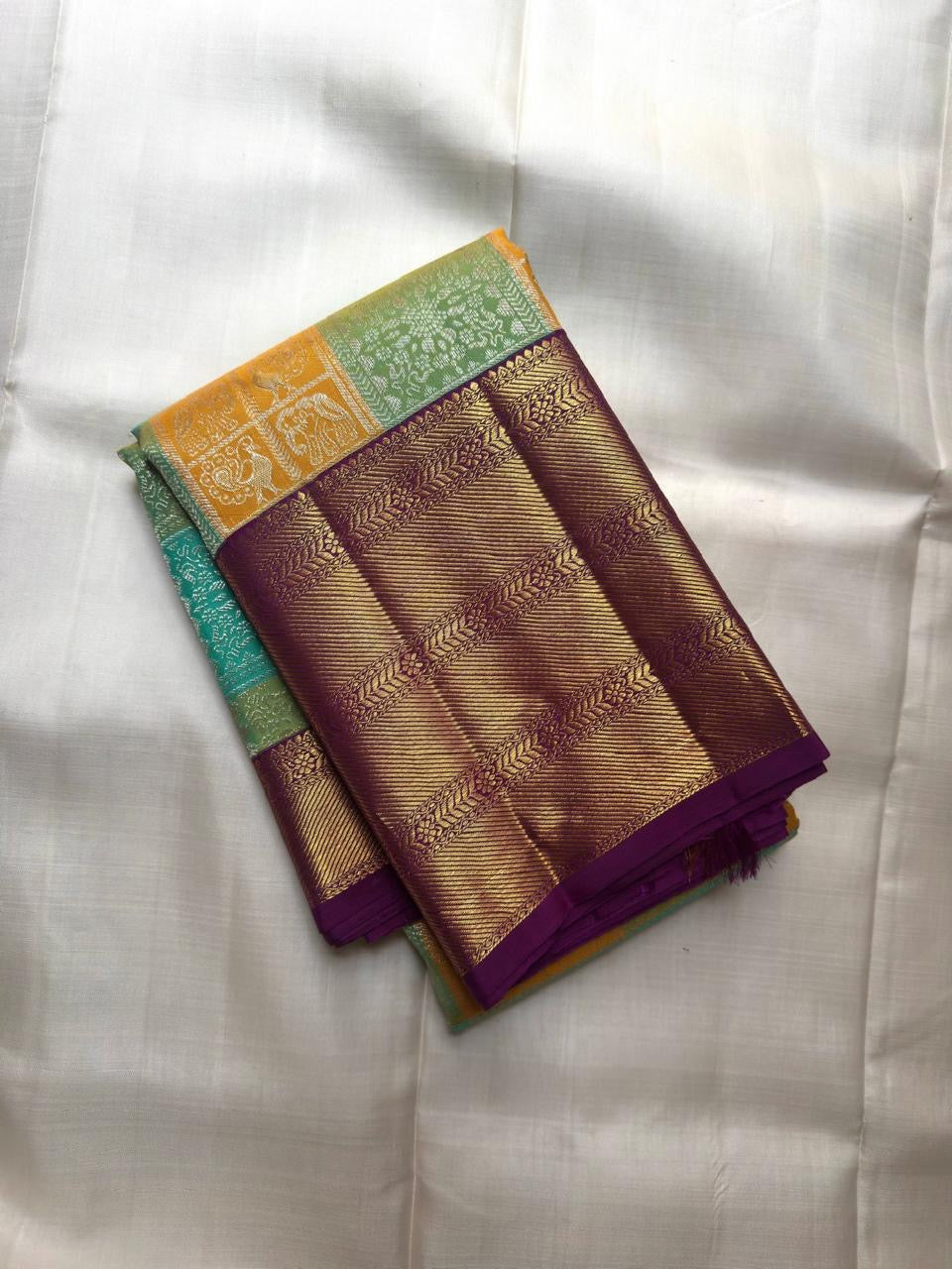 Deep purple Varisaipet border with antique gold scroll zari — KanchiPattu Bomkai Butta saree detail