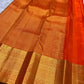 Handwoven Kanchi Pattu Veldhari saree in shot burnt orange with Zari Kattam grid, Yaanai Butta, and dark green antique gold border, full folded view