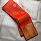 Close-up of shot burnt orange silk body with Zari Kattam gold grid and Yaanai Butta in antique gold zari — Kanchi Pattu Veldhari