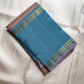 Taupe and cerulean blue handwoven pure silk KanchiPattu saree with Korvai Thazhampoo Reku border — full folded overview