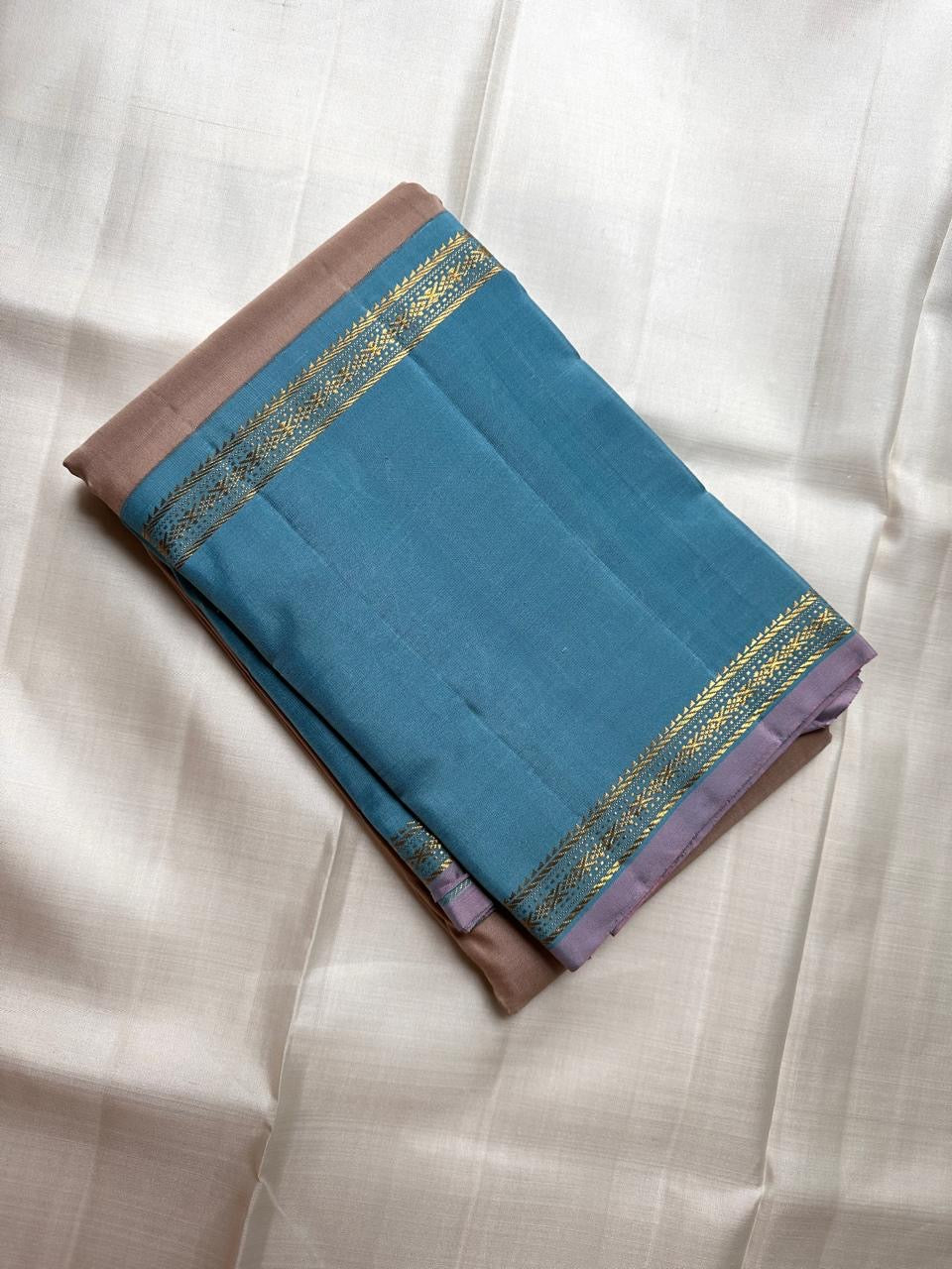 Taupe and cerulean blue handwoven pure silk KanchiPattu saree with Korvai Thazhampoo Reku border — full folded overview