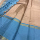 Pallu detail of taupe and cerulean blue pure silk KanchiPattu saree showing cerulean Korvai border with Thazhampoo Reku gold zari lines