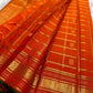 Multi-band Mayil Butta gold zari border with green selvedge on burnt orange Kanchipuram Zari Kattam saree