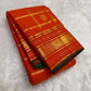 Gold zari Mayil Butta peacock pallu on burnt orange ground — Kanchipuram Zari Kattam saree
