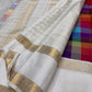 Close-up of large multicolour Paalum Pazhamum silk check body — blue, magenta, amber, purple, green woven squares