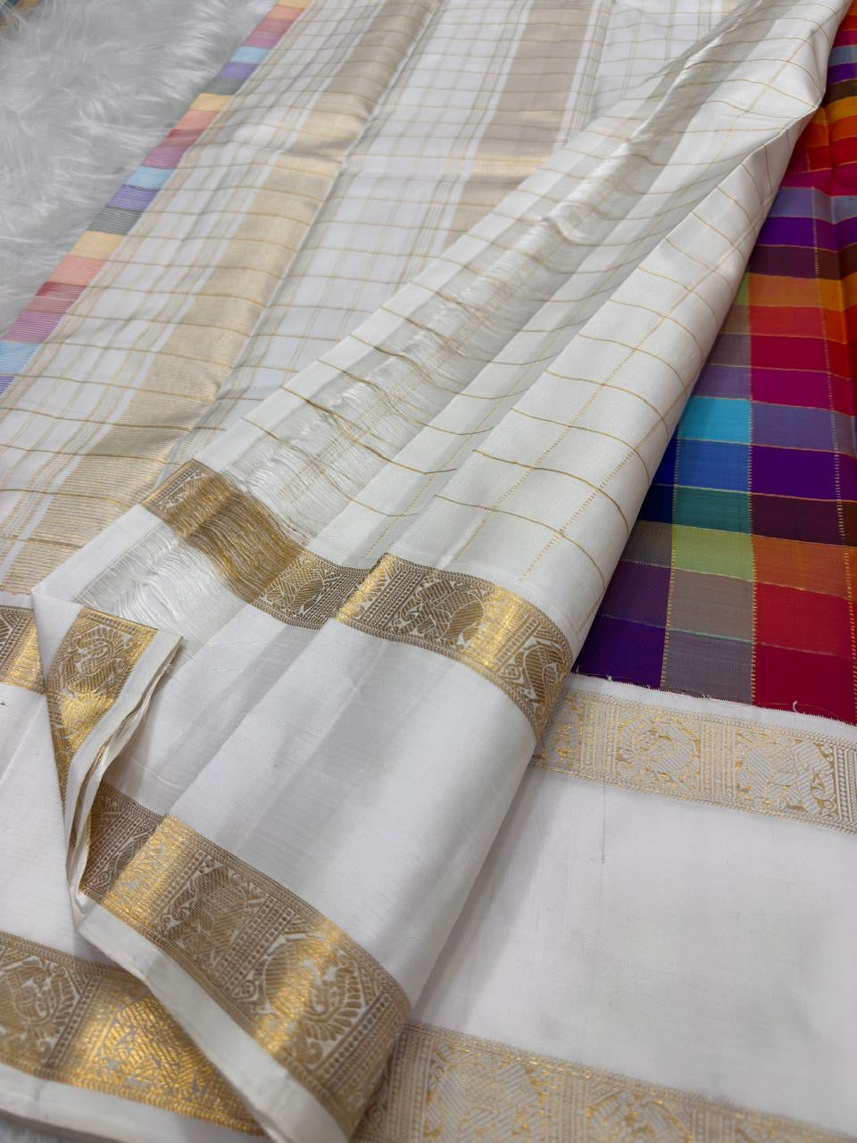 Close-up of large multicolour Paalum Pazhamum silk check body — blue, magenta, amber, purple, green woven squares