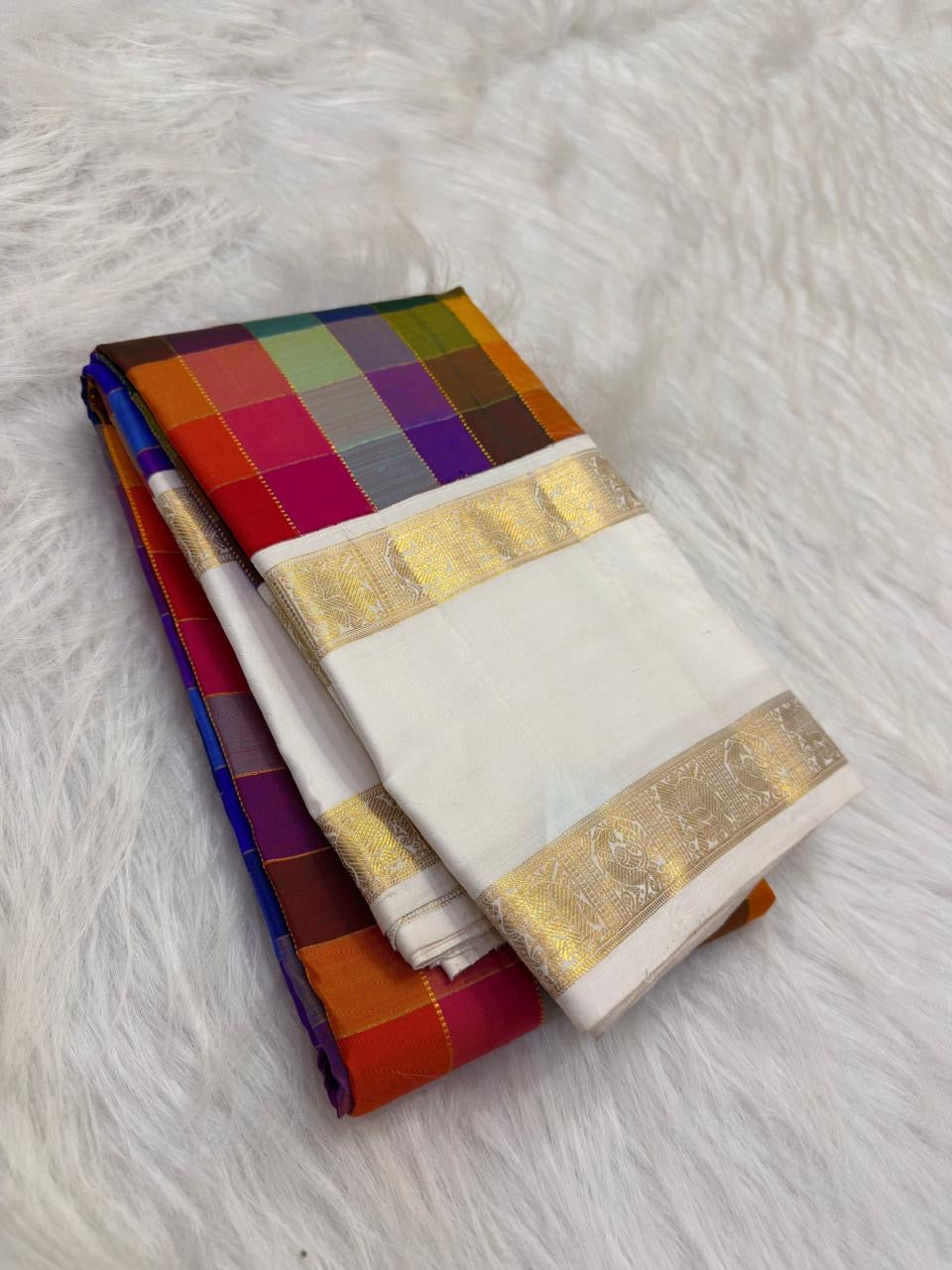 Antique gold Rettapet zari detail on deep navy border — Kanchipuram handwoven silk