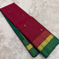 Folded view of the handwoven deep rose and bottle green Kanjivaram lightweight Korvai silk saree showing Kamalam Butta body and multicolour Varisaipet border