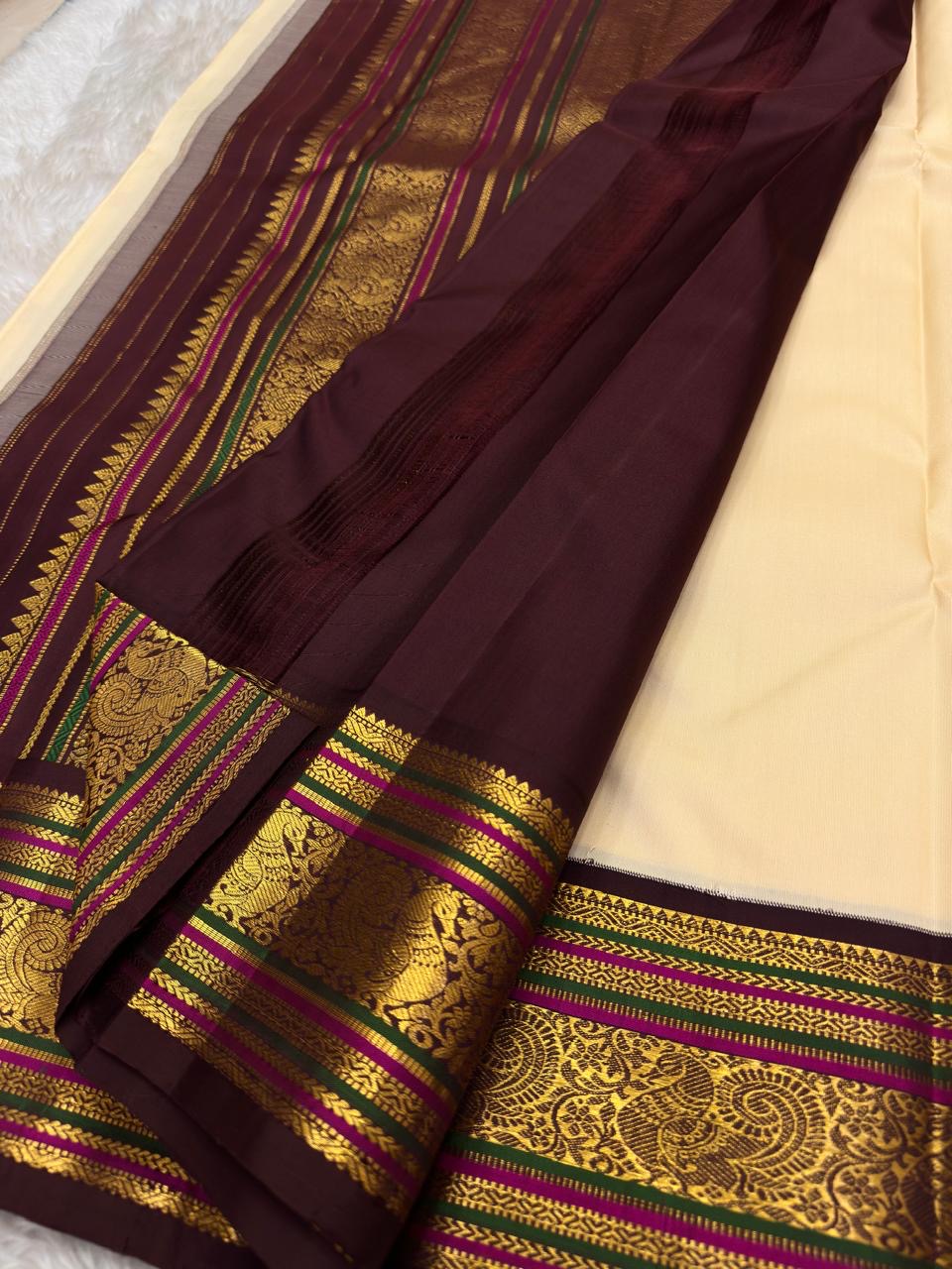 Handwoven pure silk Kanchipuram saree in ivory with scattered Yaanai Butta in arakku red silk thread and arakku red Varisaipet border with elephant procession — Idam Living
