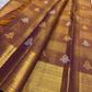 Heavy antique gold zari pallu on deep green ground — Kanjipuram Veldhari shot colour saree