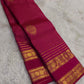 Pallu detail of arakku red pure silk Kanchipuram saree showing antique gold zari Yaanai elephant and Kamalam lotus motifs in Varisaipet border