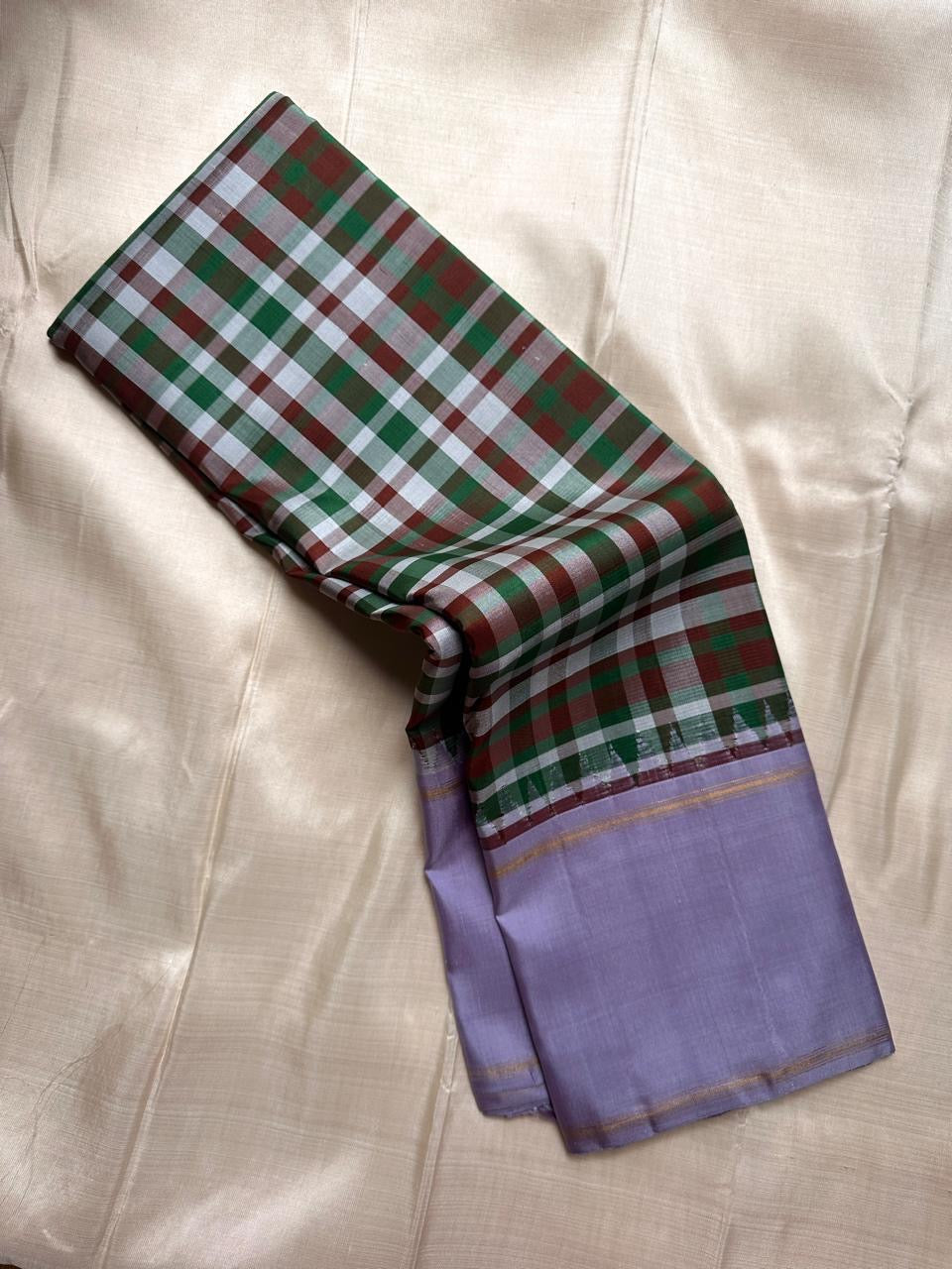 Multicolour Paalum Pazhamum handwoven pure silk Kanchipuram saree with vibrant green arakku red white olive silk check body and lavender border — full folded overview