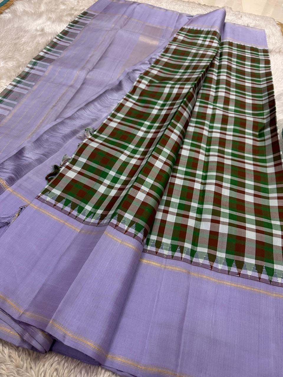 Pallu detail of multicolour Paalum Pazhamum pure silk Kanchipuram saree showing lavender ground with gold zari lines