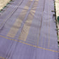 Folded view of multicolour Paalum Pazhamum handwoven pure silk Kanchipuram saree with vibrant check body and lavender border