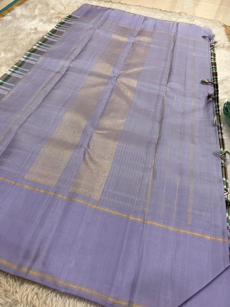 Folded view of multicolour Paalum Pazhamum handwoven pure silk Kanchipuram saree with vibrant check body and lavender border