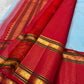 Pallu of the Kanjeevaram Korvai saree showing the Ganga Jamuna contrast — violet-purple and scarlet red with gold horizontal bands