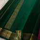 Folded view of the handwoven deep maroon and teal Kanchipuram lightweight Korvai silk saree showing Floral Butta body and Vanasringaram border