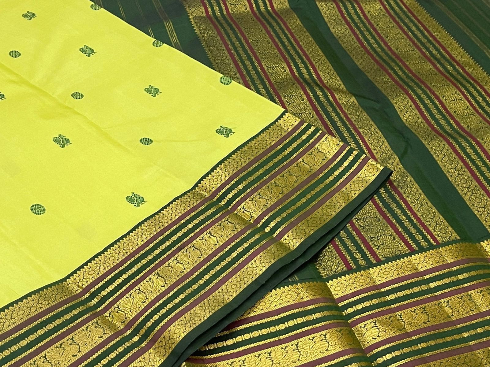 Handwoven Kanjeevaram Varisaipet saree in lime green with deep green Silk Thread Butta and dark green maroon multi-band gold zari border, full folded view