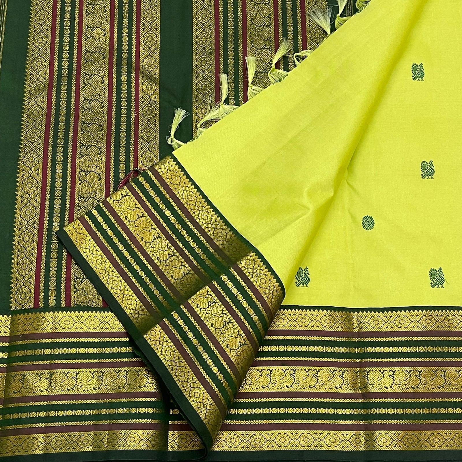 Dark green and maroon multi-band Varisaipet border with antique gold zari scrolls — Kanjeevaram saree detail