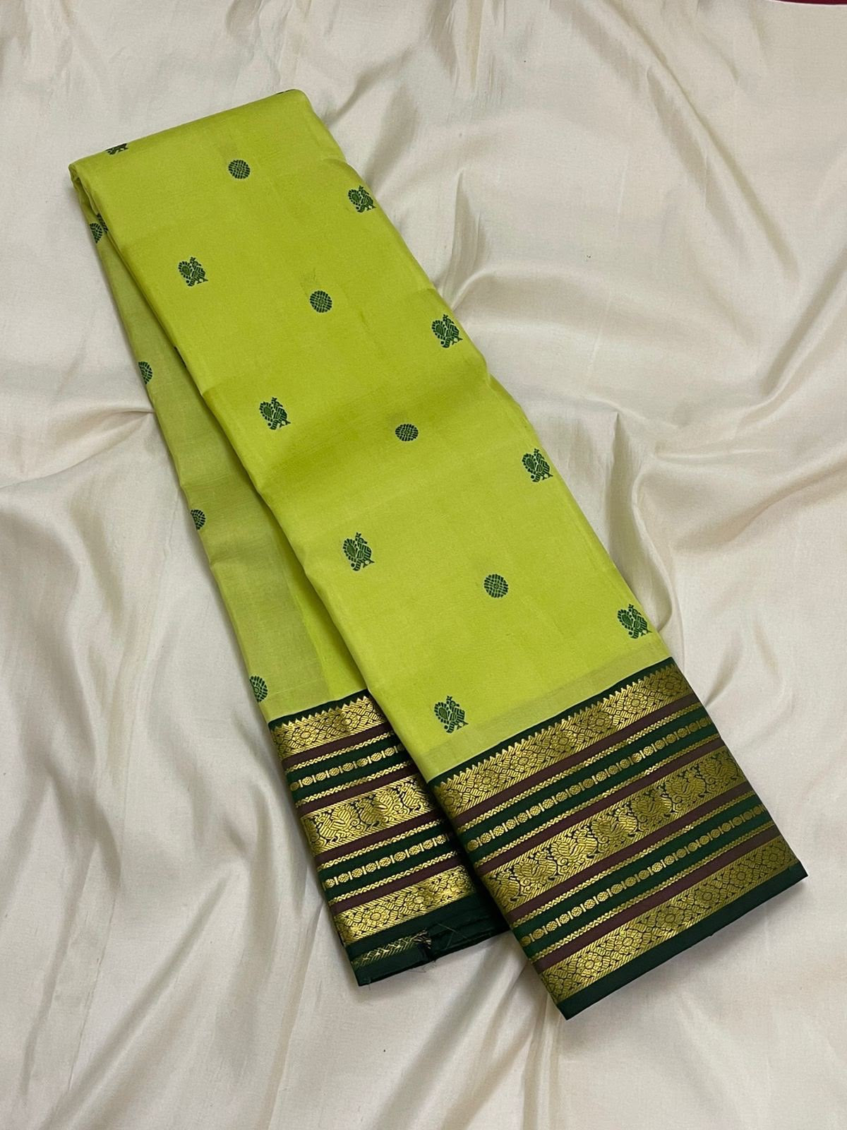 Antique gold zari floral scroll pallu on dark green Varisaipet border — Kanjeevaram lime green saree