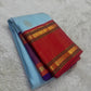 Folded view of the handwoven sky blue Kanjeevaram silk saree showing Maanga Butta body and Ganga Jamuna border