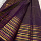 Close view of the deep purple silk body showing Varisaipet horizontal gold zari bands running continuously across the full fabric