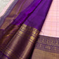 Handwoven Kancheepuram Zari Kattam saree in self-colour radiant pink with Kamalam Butta and deep purple heavy gold zari border, full folded view