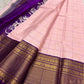 Close-up of radiant pink silk body with fine gold Zari Kattam grid and Floral Butta — Kanjeevaram saree