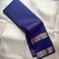 Handwoven Kanjeevaram Rettapet saree in royal blue with scattered Floral Butta and antique gold geometric zari border, full folded view