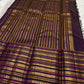 Folded view of the handwoven deep purple Kanjeevaram pure silk saree showing full body Varisaipet in gold zari from body to pallu